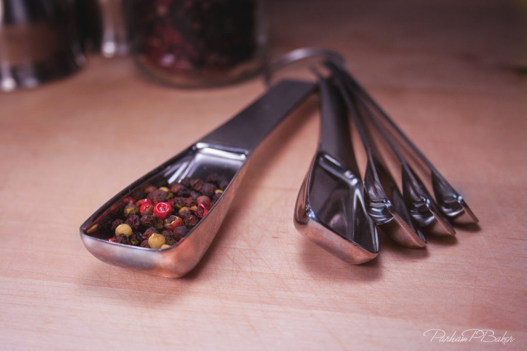 Measuring Spoons With Whole Peppercorns